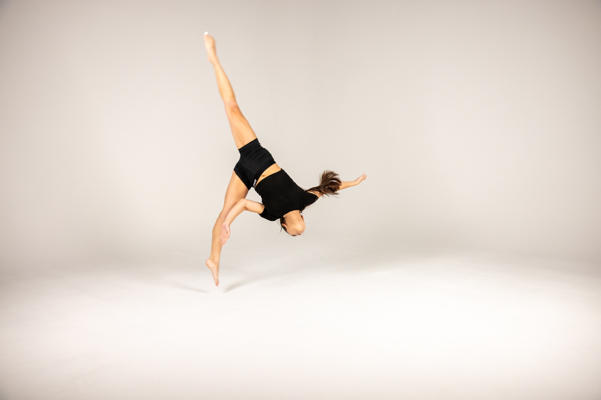 Athlete completing a strength exercise with coaching support